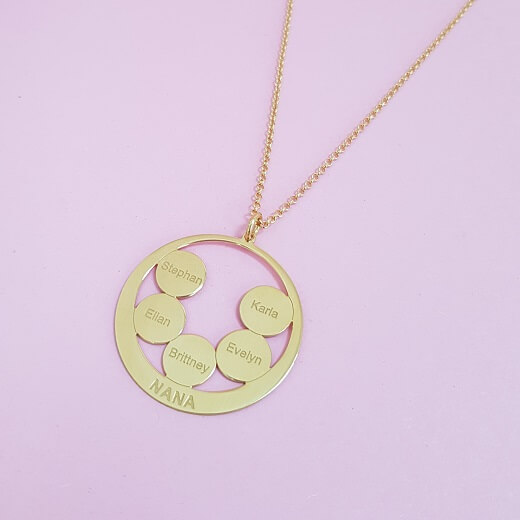 Circle Discs Engraved Nana Necklace on pink background
